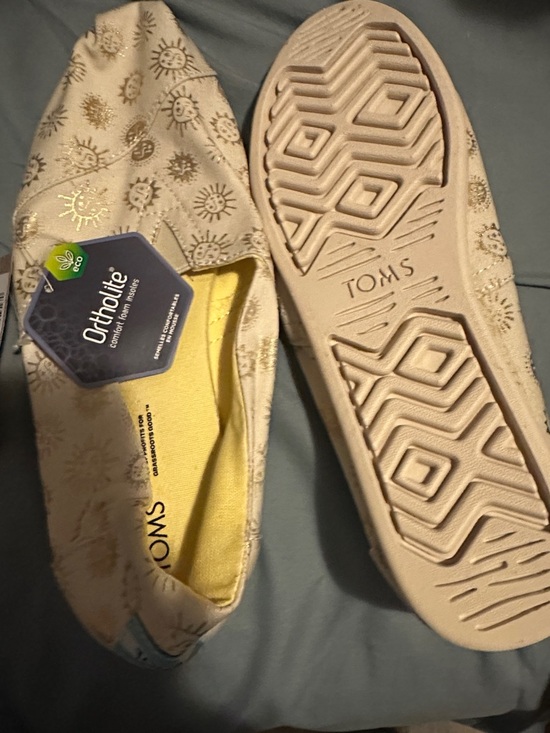 Toms Shoes - Toms Cream Slip-On Canvas Shoes with Gold Sun Print